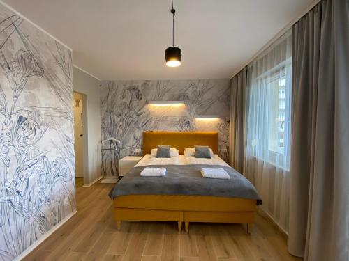 Posteľ alebo postele v izbe v ubytovaní Apartament Toruń