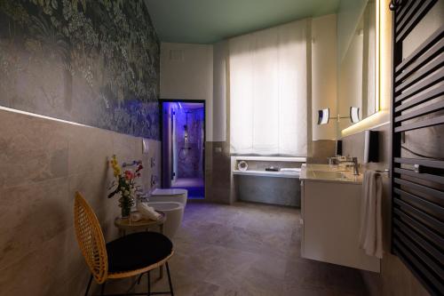 a bathroom with a toilet and a purple door at Navona 49 Luxury Suites&Apartment in Rome