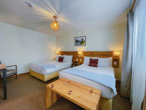 Cama ou camas em um quarto em Cooper Hotel Boutique