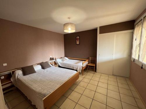 Posteľ alebo postele v izbe v ubytovaní Maison Valras-Plage, 4 pièces, 8 personnes - FR-1-701-49