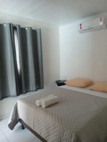 Postel nebo postele na pokoji v ubytování FRANCÊS FLATS