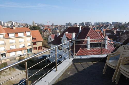 a balcony with a view of a city at Westhoek Apartments in De Panne