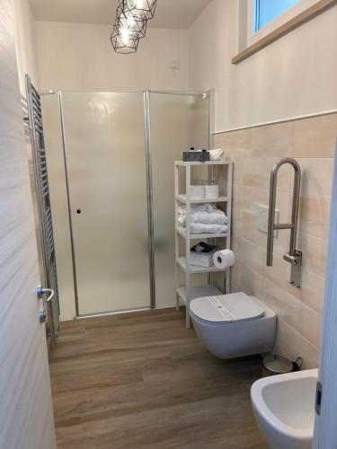 a bathroom with a shower and a toilet and a sink at Hotel Panoramica in Bardolino