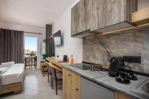 a kitchen with a sink and a counter top at Jimmy’s Garden in Faliraki