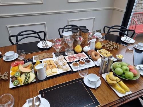 a table with a bunch of food on it at Blackrock B&B in Dublin