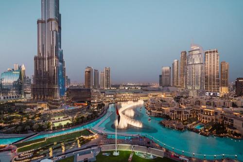 a view of a city with tall buildings and a river at Elite Royal Apartment - Full Burj Khalifa and Fountain View - The Royal in Dubai