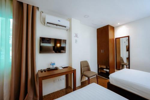 Postel nebo postele na pokoji v ubytování Emerald Boutique Hotel