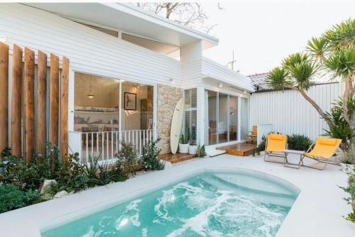 a swimming pool in the backyard of a house at wyn in Ko Larn