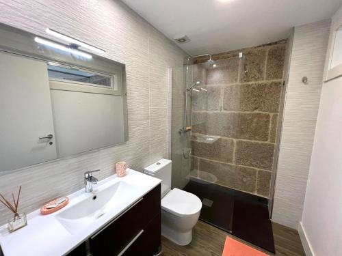 a bathroom with a toilet and a sink and a shower at Casa Cousiño Zona Monumental in Pontevedra