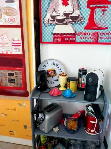 a shelf with a radio and other items on it at THE ROOFTOP in Pero