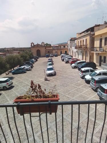 a parking lot with a bunch of cars parked at La Perla Di Noto in Noto