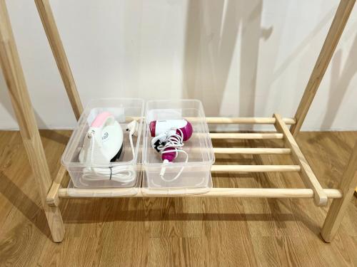 a plastic container with nintendo wii controllers in it at Infistay Homestay - Sunway Geo Avenue, Sunway Pyramid, Sunway Lagoon, Sunway University, Sunway Medical Centre in Subang Jaya