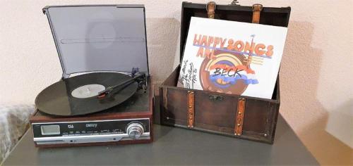 a table with a cd and a box with a cds at Podlaski Zakątek in Bereżyszcze