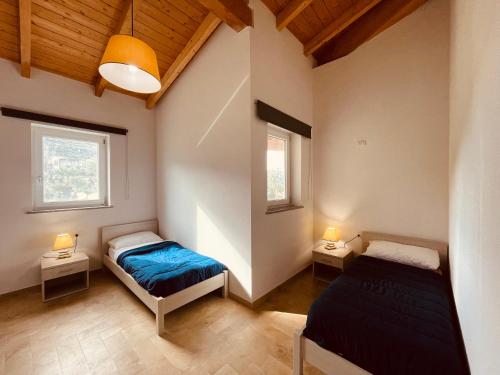 Ένα ή περισσότερα κρεβάτια σε δωμάτιο στο Camping Tonnara