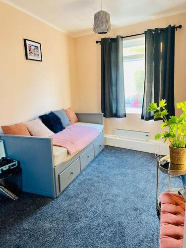 a bedroom with a bed and a window at 2 Bedroom flat on Tottenham High Rd. in London