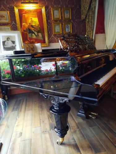 a grand piano sitting in a room with at The Lonsdale in Blackpool