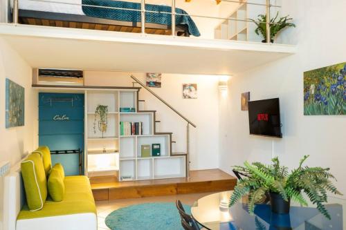 a living room with a couch and a bunk bed at [DUOMO WALKING DISTANCE] Central Loft in Milan