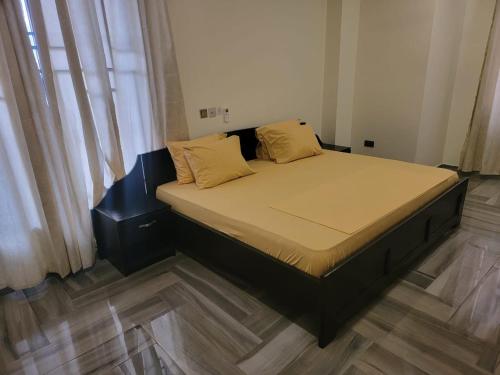 Llit o llits en una habitació de VaQ Apartments