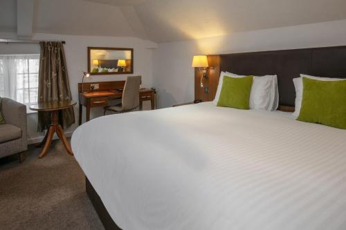 a large white bed in a hotel room at Best Western Annesley House Hotel in Norwich