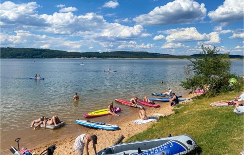 a group of people on the beach at a lake at Tiny Haus 49 Am Brombachsee in Pleinfeld