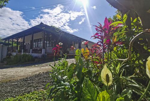 a person riding a bike in front of a building at VILLA ALEJANDRA - Hermosa FINCA cerca al centro - Sendero - Jacuzzi in Popayan