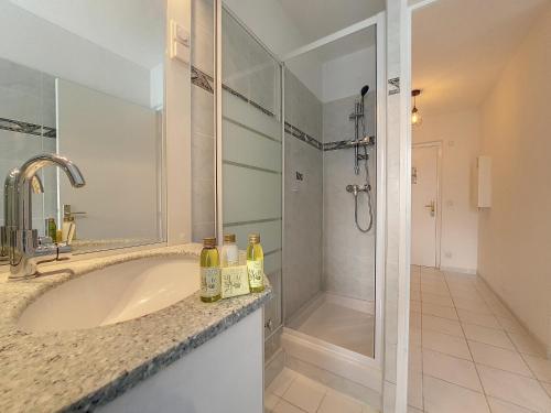 a bathroom with a large sink and a shower at Nestor&Jeeves - VANINA - Central - Close sea in Nice