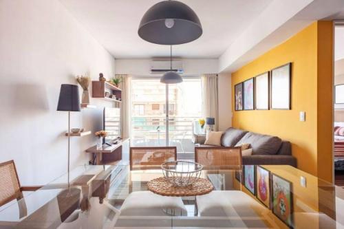 a living room with a couch and a table at Quartier San Telmo Suites 10 in Buenos Aires