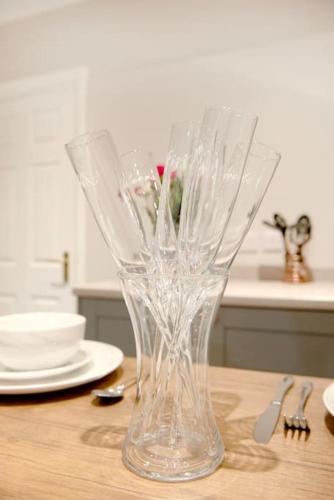 a clear glass vase sitting on top of a table at Garden by the Bay Southport in Southport