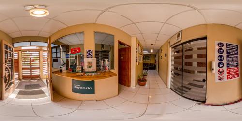 a pharmacy lobby with a pharmacy counter in a store at Hotel Barlovento Inn Piura in Piura