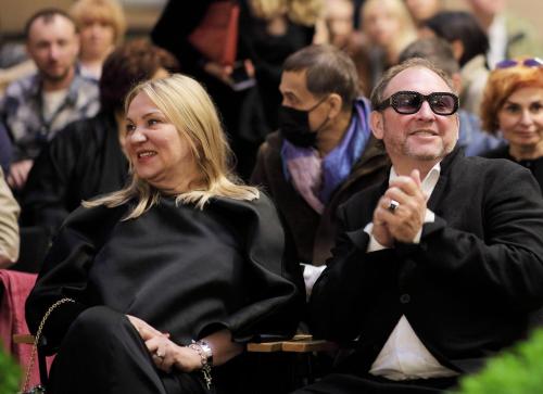 a man and woman sitting in a crowd of people at Vozdvyzhensky Boutique Hotel in Kyiv
