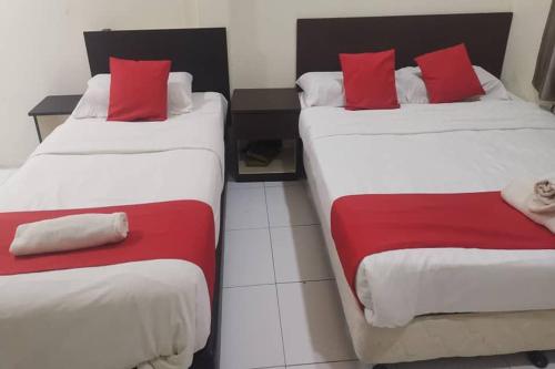 Postel nebo postele na pokoji v ubytování Q Hotel Temerloh