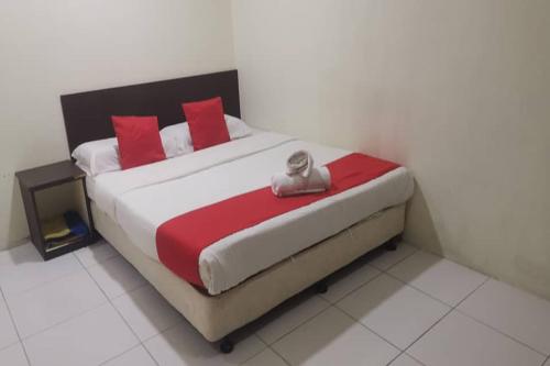 Postel nebo postele na pokoji v ubytování Q Hotel Temerloh