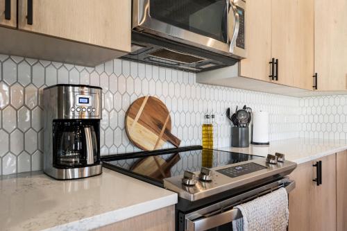 a kitchen with a stove and a counter top at Richmond No. 267 in Richmond