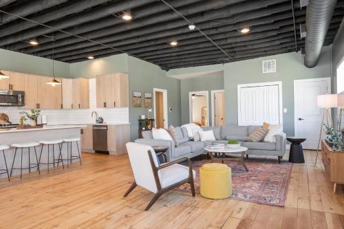 a living room and kitchen with a couch and a table at Richmond No. 267 in Richmond