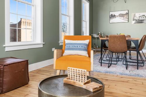 a living room with a chair and a table at Richmond No. 267 in Richmond