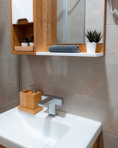 a bathroom with a sink and a mirror at Studio Merdzan in Divčibare