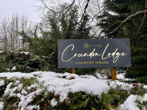 a sign for a country house in the snow at Coundon Lodge Coventry in Coventry