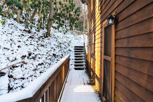 a stairway leading up to a house in the snow at River Front Resort in Elkins