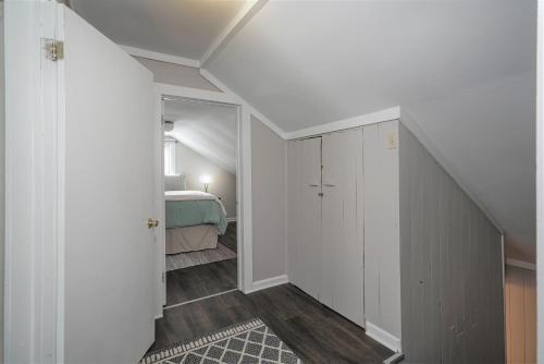 a hallway leading to a bedroom with a bed at River Front Resort in Elkins