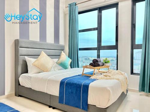 a bedroom with a bed and a large window at OngKimWee Residence By Heystay Management in Melaka