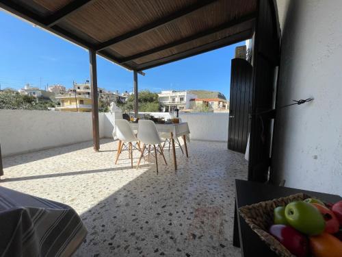 Балкон или терраса в Fyrogenis Cozy Family Friendly House in Gournes