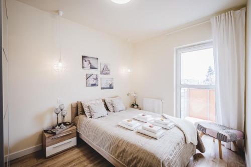 Posteľ alebo postele v izbe v ubytovaní Apartament Niko