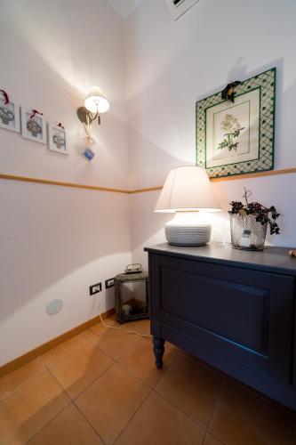 a room with a table with a lamp on it at Amalfi Coast Donna Carmela Apartment Pontone holiday house in Scala