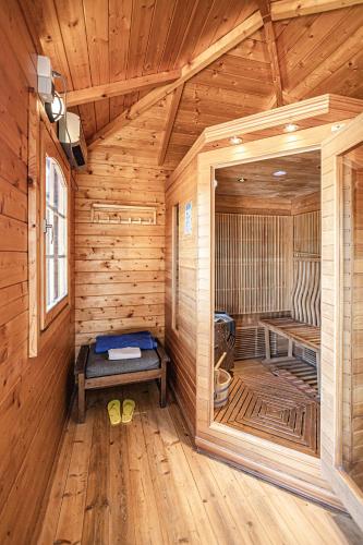a room with a sauna in a wooden cabin at Cerro de Hijar in Tolox
