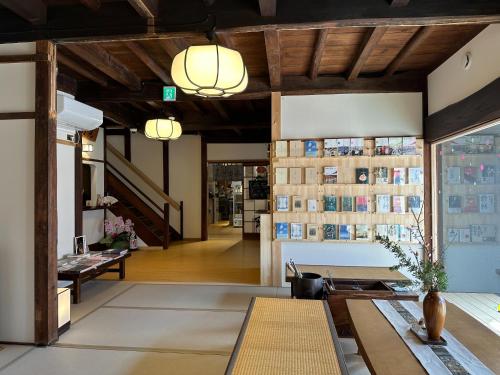 a room with a table and chairs and a hallway at Ogawayado Korin - Vacation STAY 95247v in Namegawa