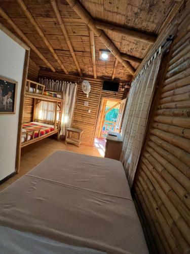 Hotel Campestre Campos Verdesにあるベッド