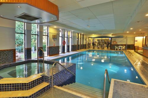 a large swimming pool in a hotel room at Woodlands Hotel, BW Signature Collection in Dundee
