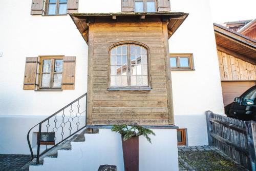 a tiny house with a window on the stairs at Naturhaus Luminus in Bad Aibling