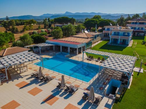an aerial view of a house with a swimming pool at Mesogeios Hotel in Marathopolis