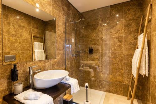 a bathroom with a sink and a shower at Fab's House in Faro